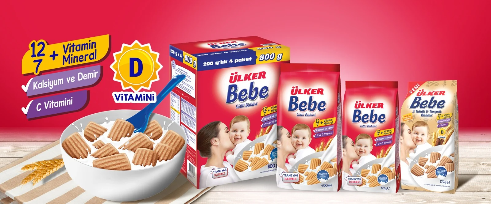 Ülker Bebe afişi: Bebe süt bisküvisi paketleri, vitamin ve mineral bilgisi ve kasede bisküvi.