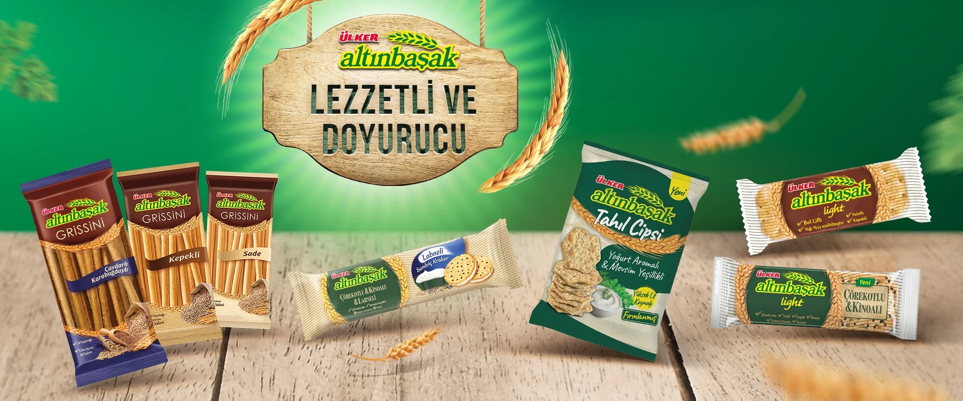 Ülker Altınbaşak afişi: “Lezzetli ve doyurucu” yazısı ve Altınbaşak gristini, kraker ve cips ürünleri.